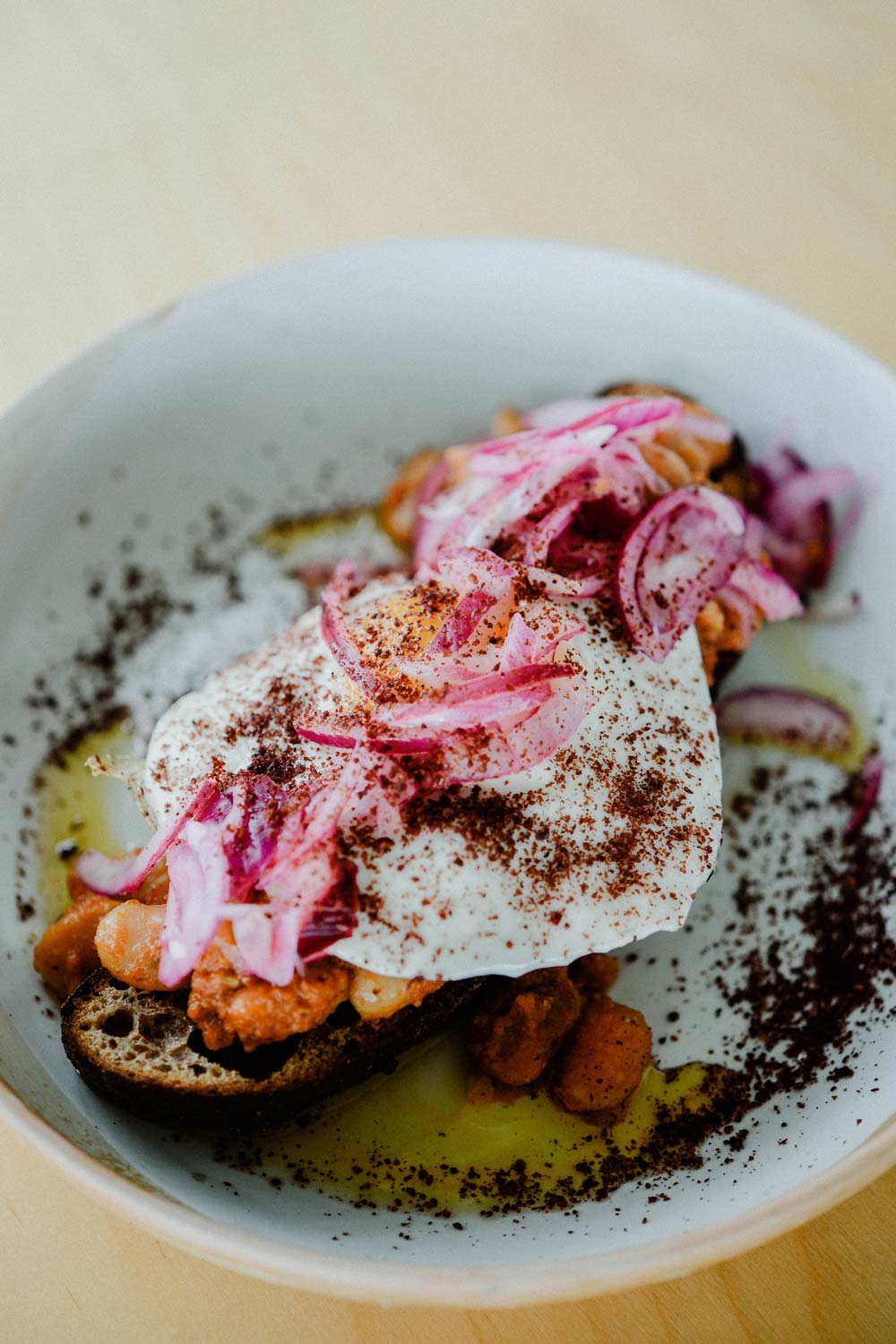 Fried egg, beans and pickled red onion on sourdough toast at Temple cafe